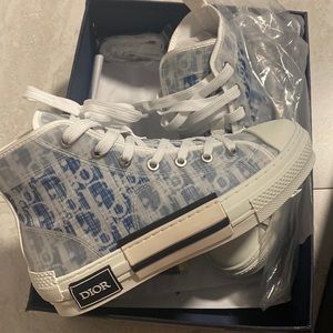 Brand new Dior high top sneakers. They were a gift